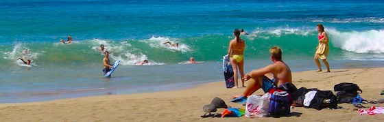 Bodyboarding and swimming at Honolua Beach for residents and visitors of Maui, Hawaii. Life in Hawaii can be this good.